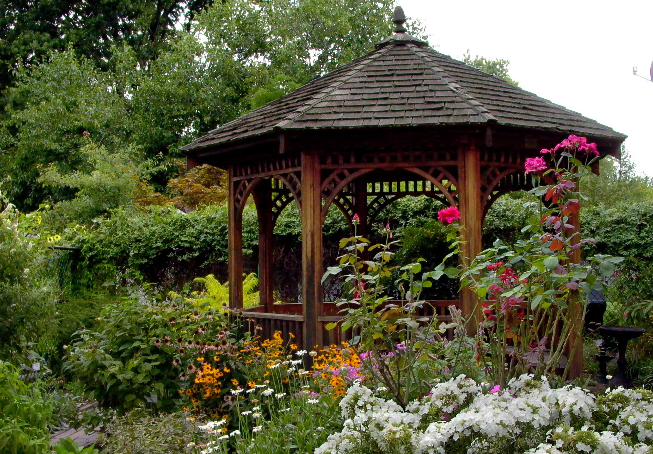 Library gazebo surrounded by flowers.