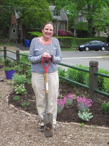 Celia Denton takes a break from replanting Bed 8.