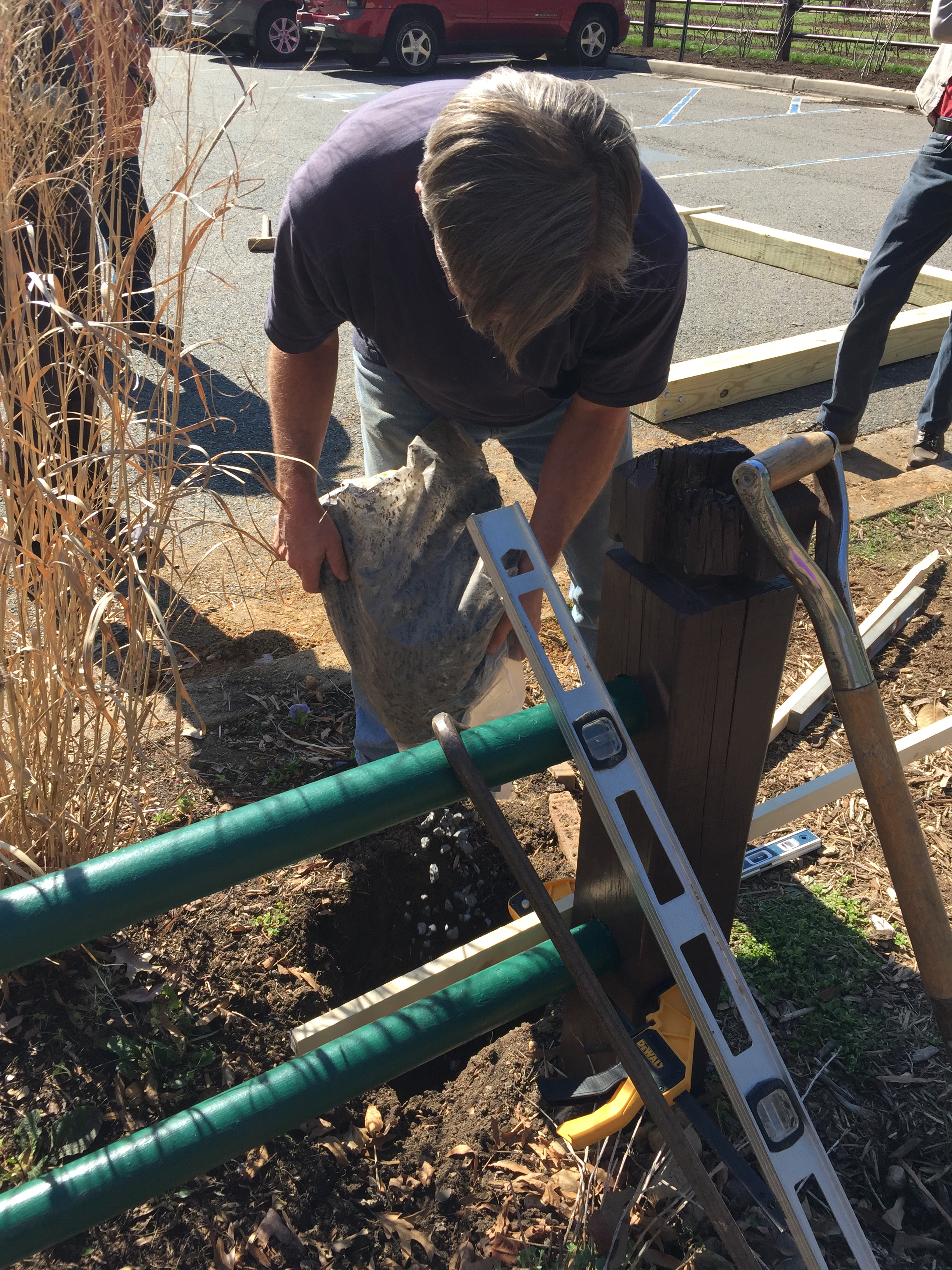 Doug prepares the foundations for the arbor.