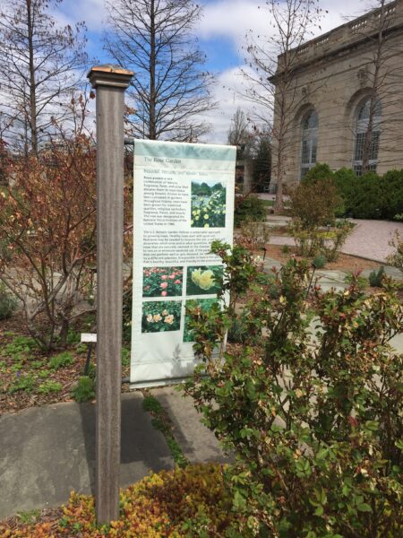 Informational signage in the gardens takes the form of banners, signboards, and individual plant labels