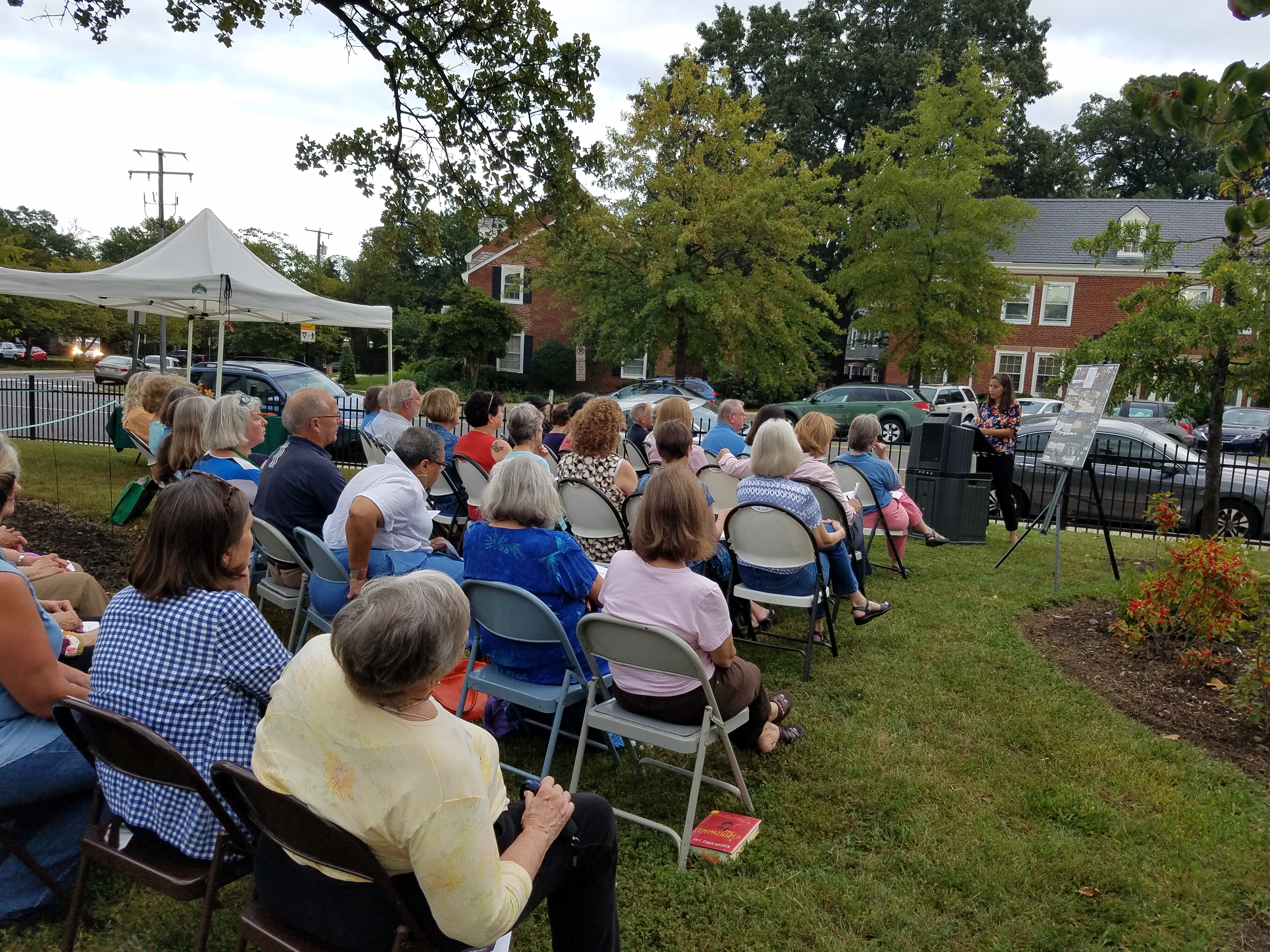 Master Gardeners and guests listening to dedication ceremony