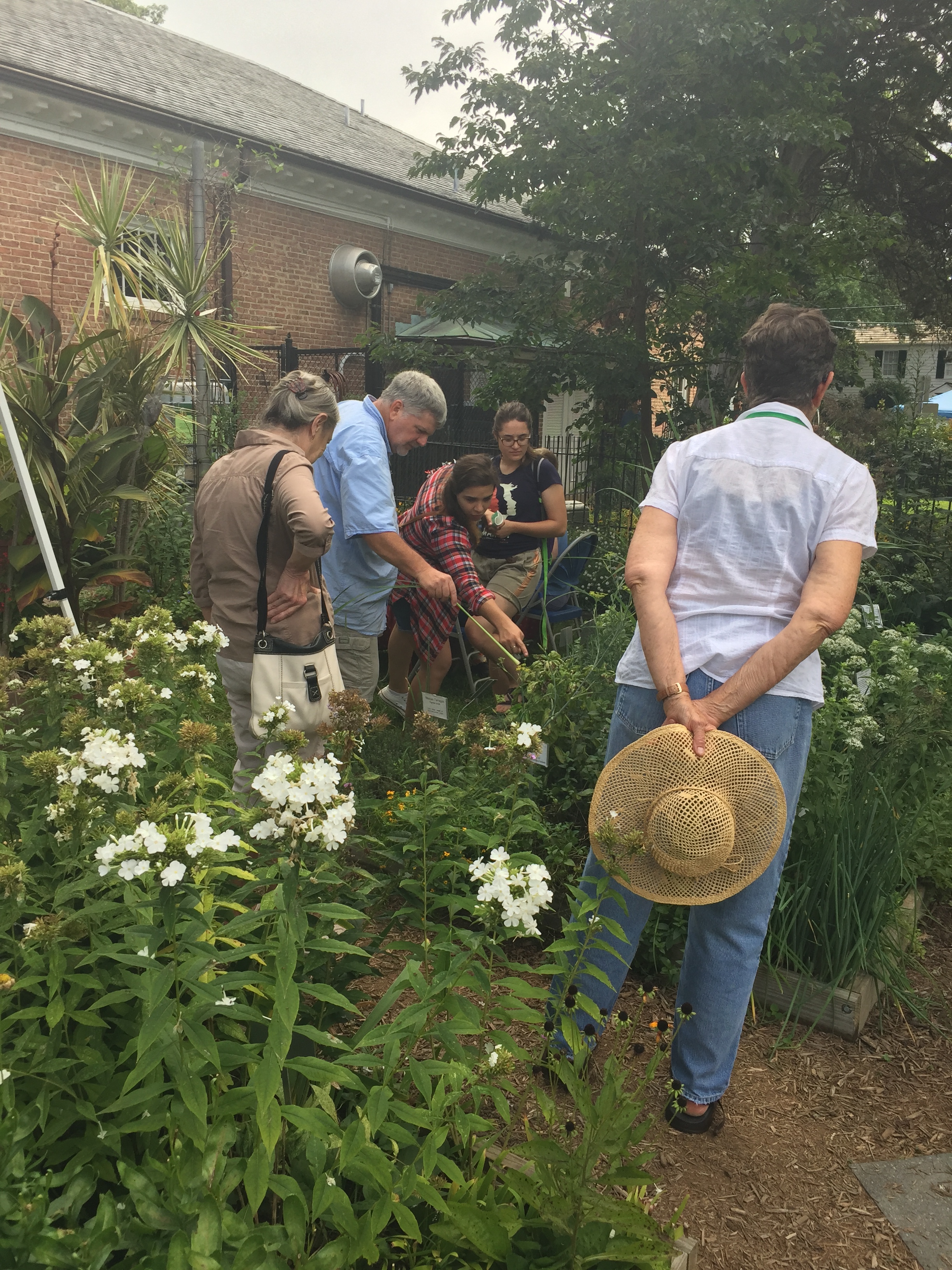 Paul gives a tour of herb garden during AutumnFest.
