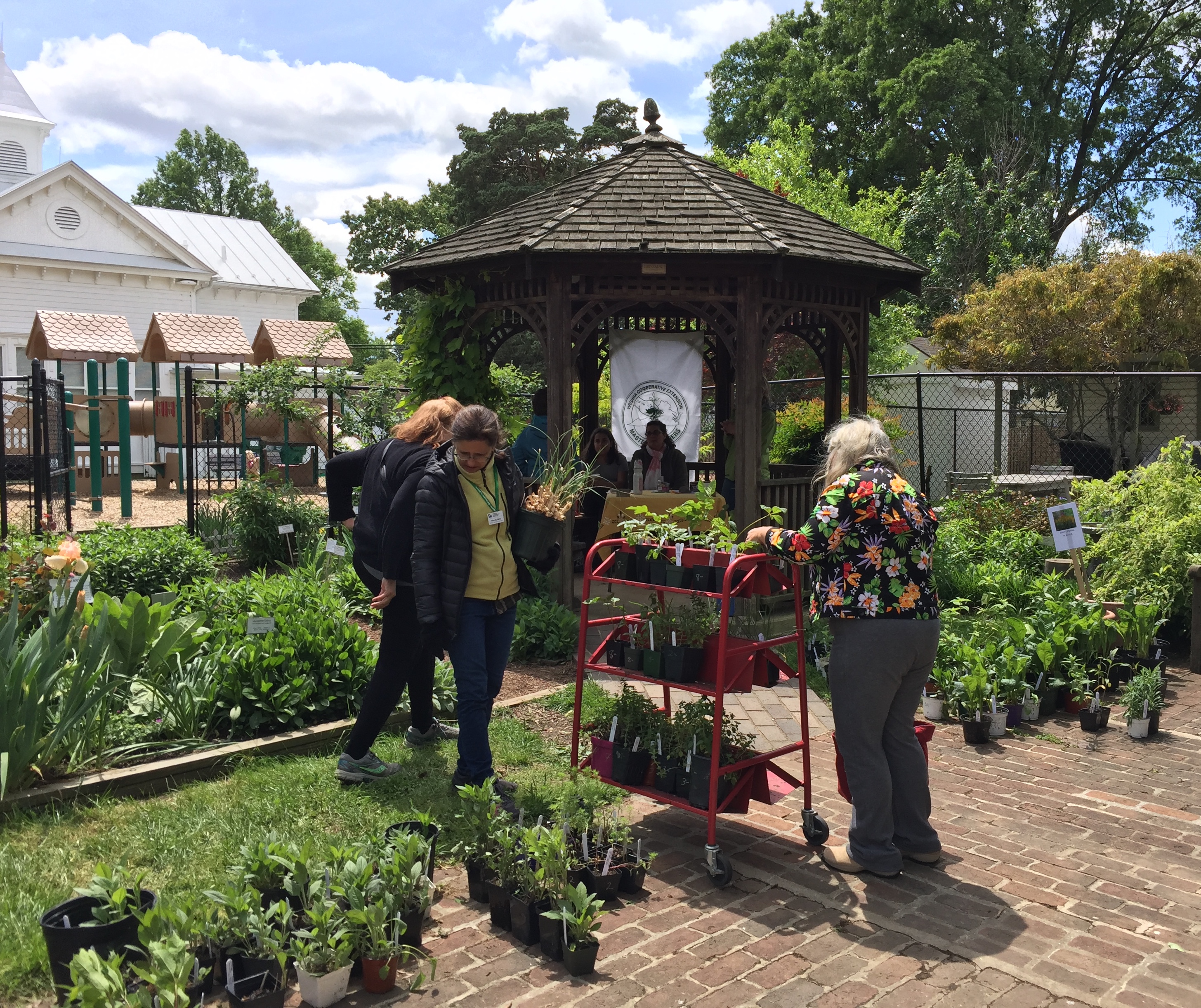 Wendy assists customers at the spring plant sale.