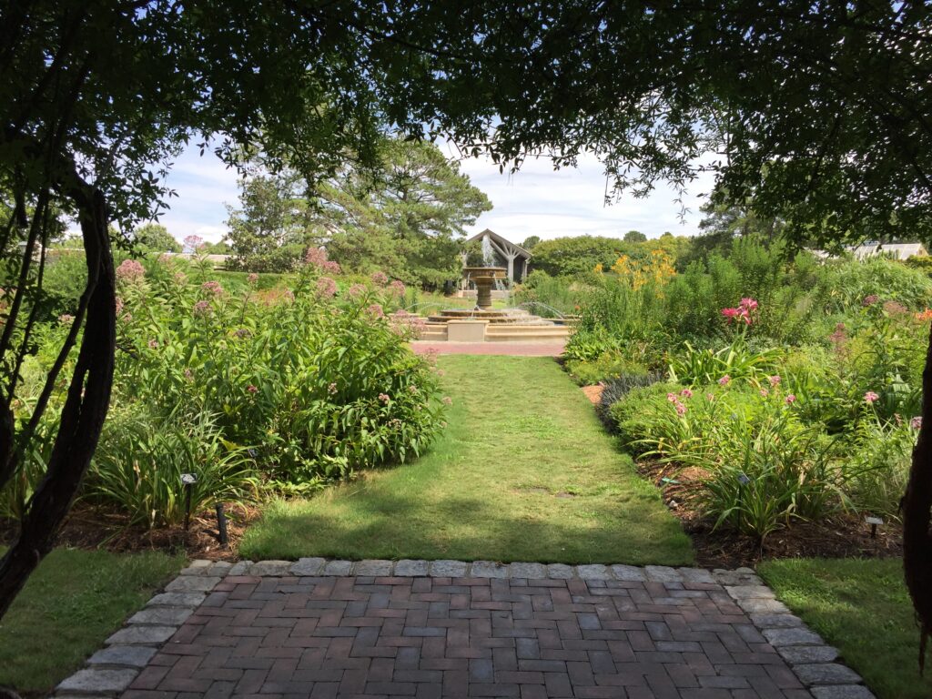 A covered entrance to the Perennial Garden leads to a central fountain. Photo © 2018 Elaine Mills