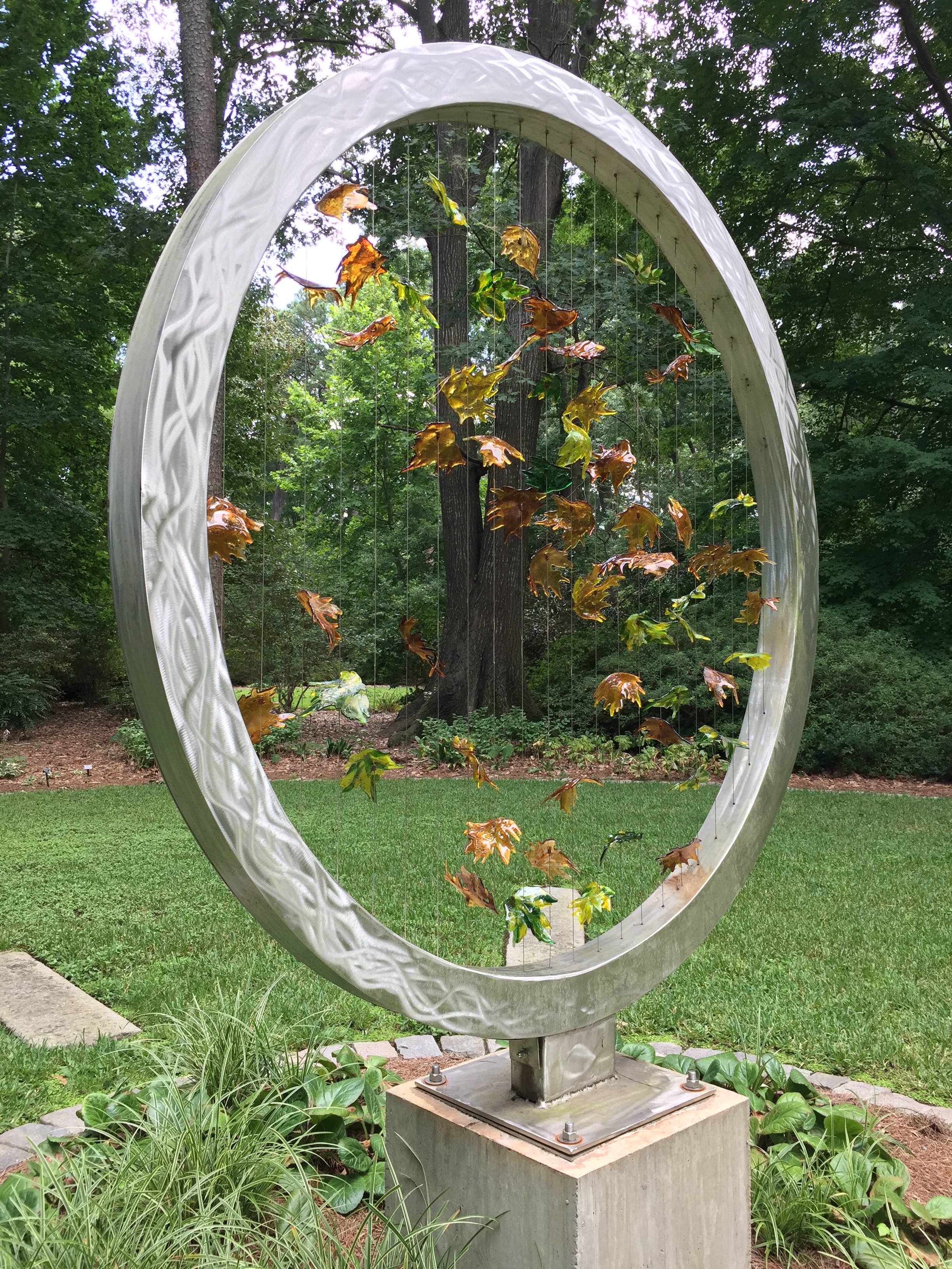 A beautiful art piece with falling leaves in the Reflection Garden. Photo © 2018 Elaine Mills.