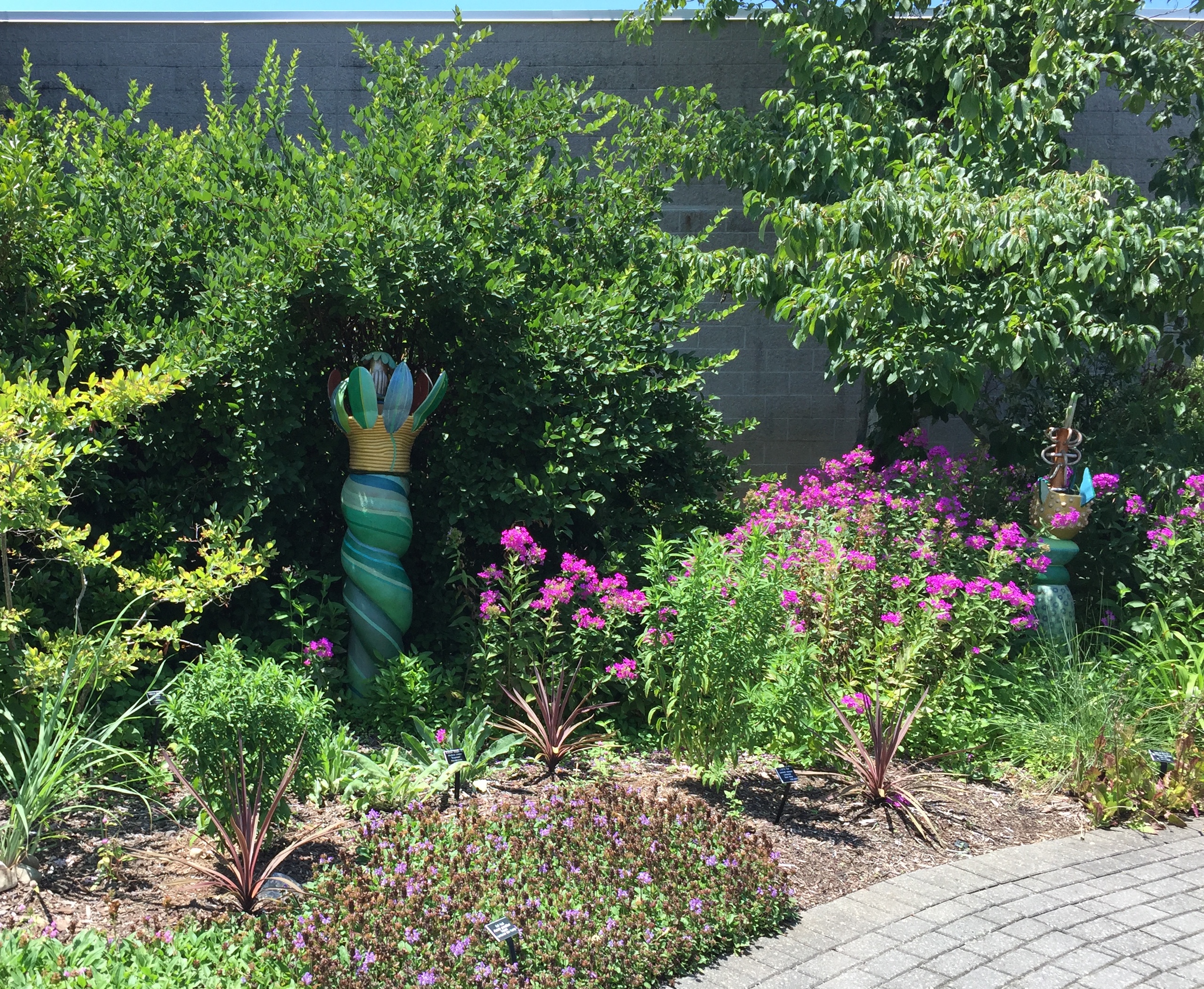 Clay flowers by Barbara Kobylinska in the Sensory Garden. Photo © 2018 Elaine Mills.