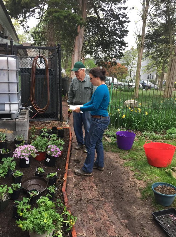 Ana Karla and Shrive confer about placement of plants.