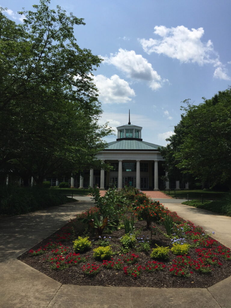 Formal beds of annuals and perennials lead to the Visitors’ Pavilion at Daniel Stowe Botanical Garden.