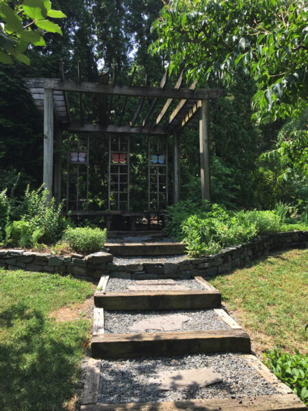 Butterfly-themed shelter in the Asian section of the garden.
