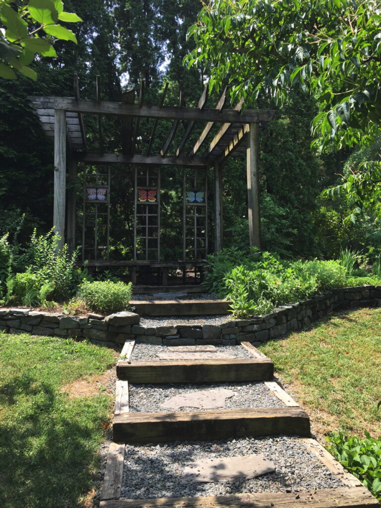 Butterfly-themed shelter in the Asian section of the garden.
