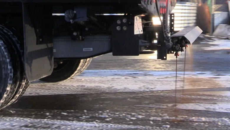 A city truck dispenses beet juice as an anti-icing measure.