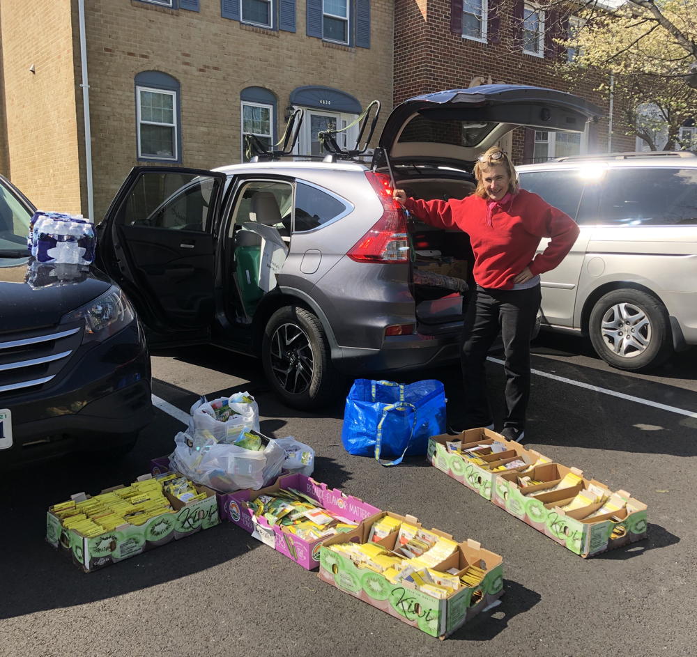 Extension Agent Kirsten Conrad delivers seeds for distribution
