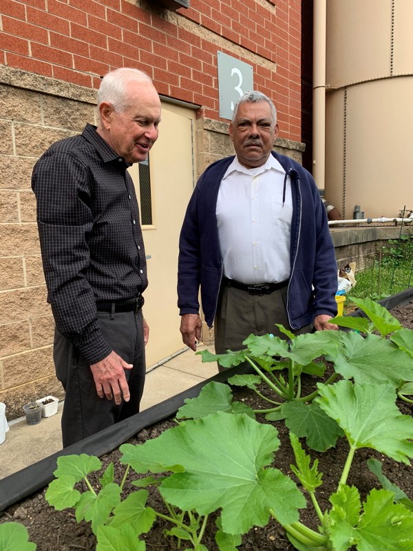 Seniors at the Langston-Brown Community Center in Arlington garden in 2019.