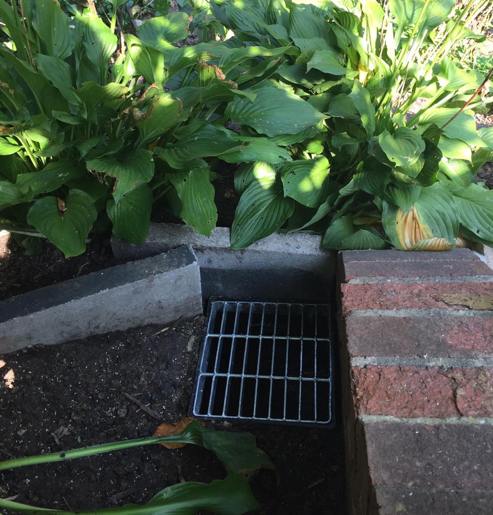 Drain on property line to capture runoff from street