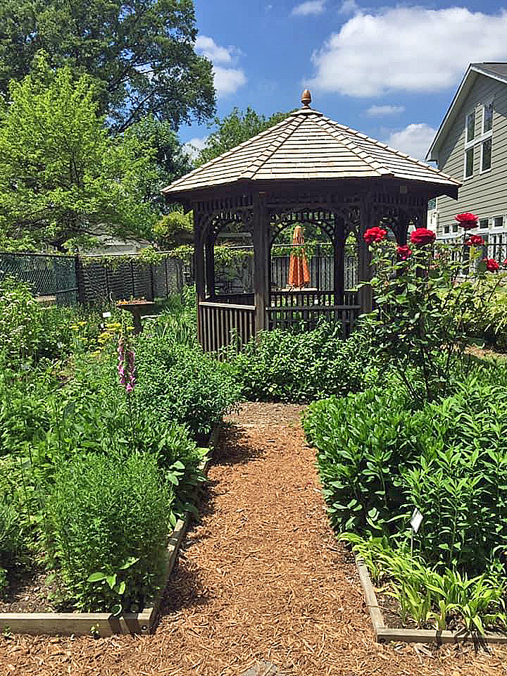 The gazebo overlooking the four beds of the Herb Garden