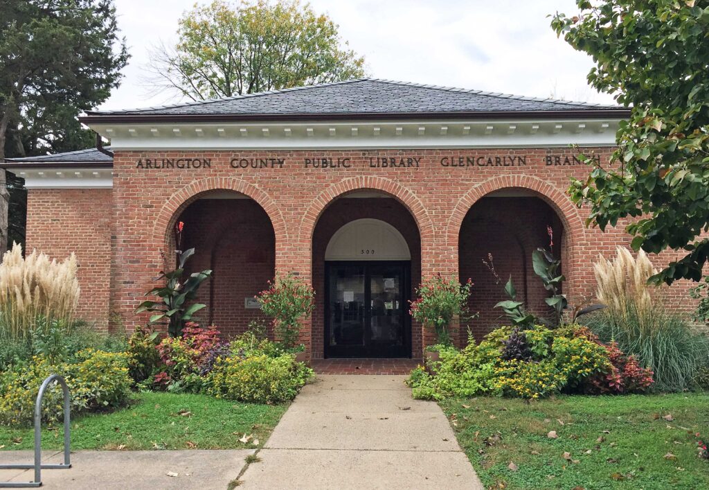 Library front flanked by flower beds