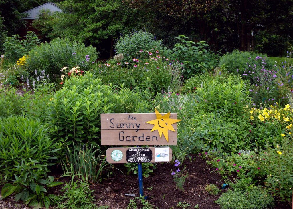 Sunny garden beds with sign