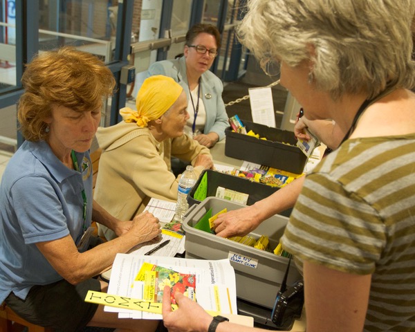 Central library plant clinic workers help patron