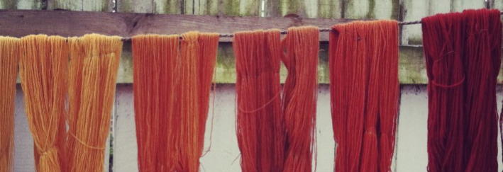 Skeins dyed naturally with madder root, hanging to dry, at Colonial Williamsburg, Virginia, USA.