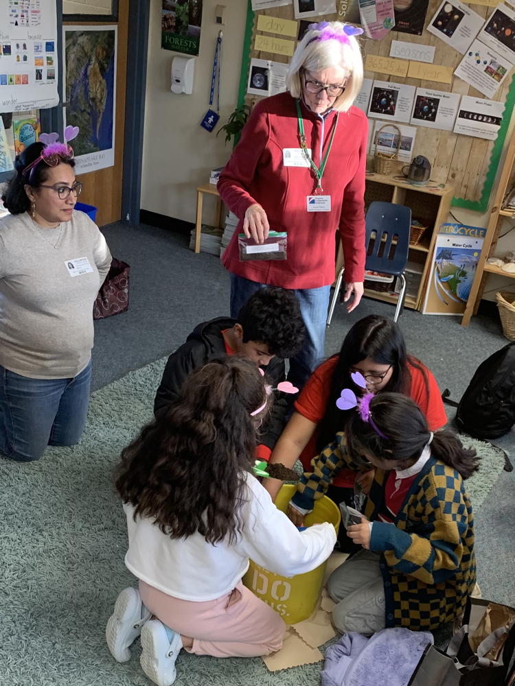 EMGs Anne Reed and Sue Viswanatha teaching students about seed stratification