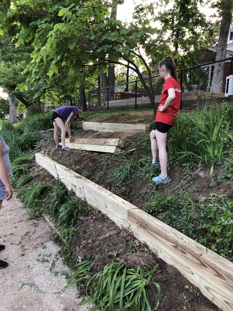 Girl Scout Troop building a retaining slope