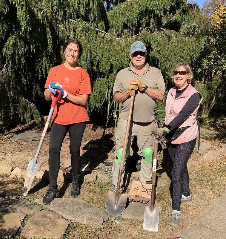 Beth Kramer, Bob Besse, and Kathy Potter work on creating a path from the YMCA to Simpson Garden.